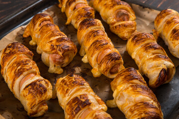 Homemade pastries, sausages in the dough with their own hands, appetizing and simple recipe.