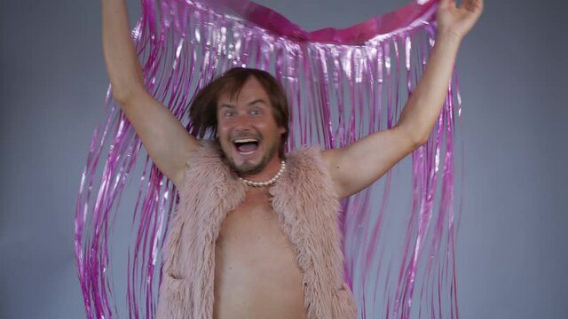 Young funny freak. A meme dressing up. Guy gay. Funny man dancing.