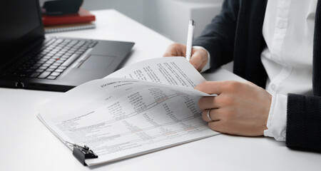 Cropped view of businessman signs a document or contract. Finance concept