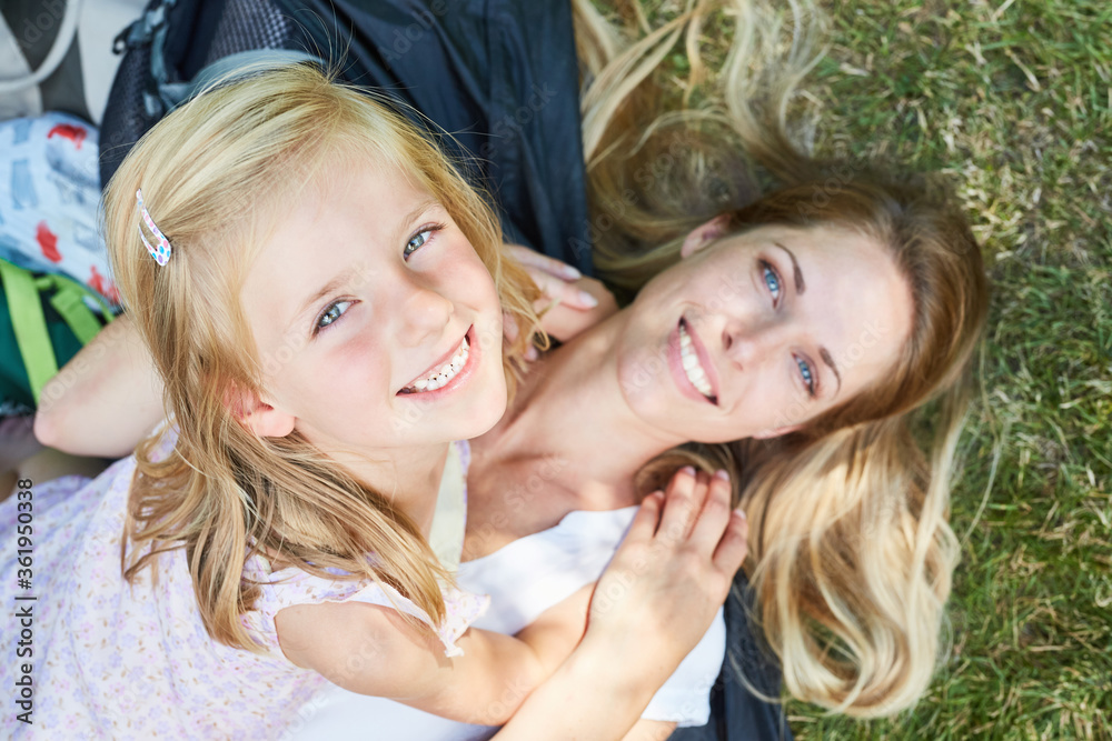 Wall mural Happy girl together with the mother