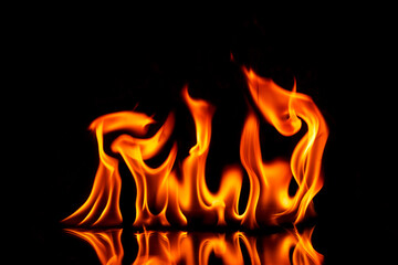 Fire with reflection on a dark background.