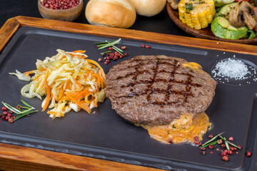 Grilled beef steak with cheese and vegetables