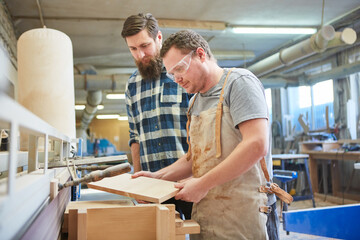 The furniture manufacturer team controls wood quality