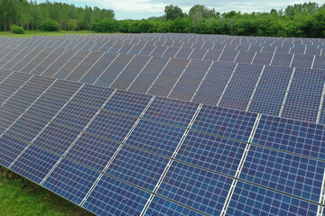 Renewable solar power plant. Aerial view as solar energy is converted by solar cells into electrical current. Alternative clean green energy renewable solar energy use. In Europe, Hungary.