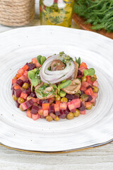 Boiled vegetables salad on a white plate