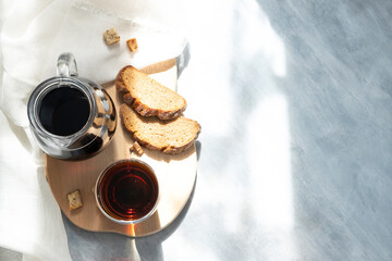 a glass of kvass, rye bread on a gray background