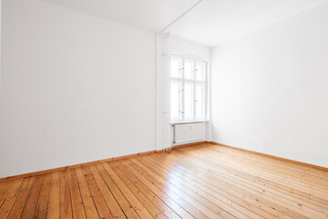 Fototapeta na wymiar empty white room in apartment flat with hardwood floor and window
