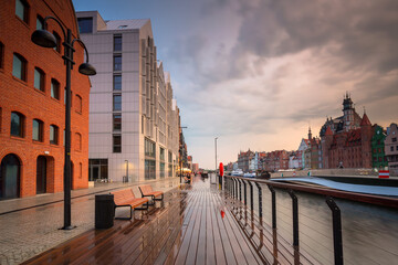 Old town in Gdansk over the Motlawa river at rainy sunset, Poland.