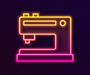 Glowing neon line Sewing machine icon isolated on black background. Vector Illustration.