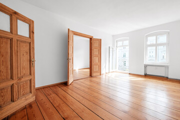 empty living room in apartment flat with wooden floor and balcony - obrazy, fototapety, plakaty