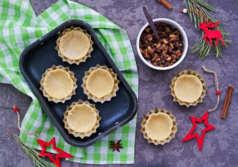 Step-by-step cooking of mince pies  traditional British Christmas shortcrust pastry cakes stuffed with dried fruits, nuts and apples.