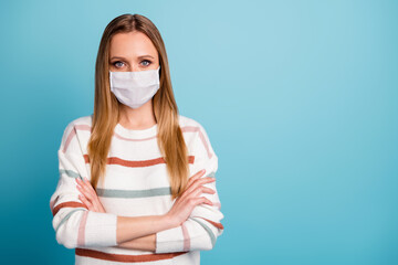 Close-up portrait of her she nice girl wearing safety cotton reusable mask folded arms mers cov influenza stay home contamination copy space isolated bright vivid shine vibrant blue color background