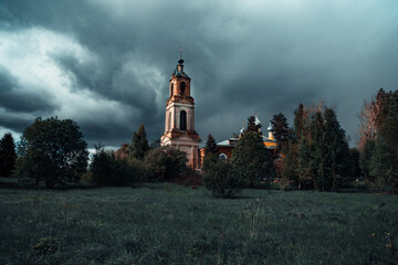An old stone Church against a gloomy overcast sky