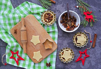 Step-by-step cooking of mince pies  traditional British Christmas shortcrust pastry cakes stuffed with dried fruits, nuts and apples.
