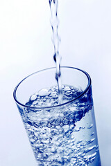 Pouring water into a glass