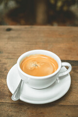 black coffee on wood table.vertical image
