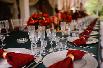 Romantically decorated table for a special event. Red decoration for celebration
