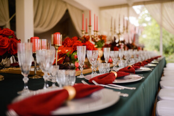 Romantically decorated table for a special event. Red decoration for celebration