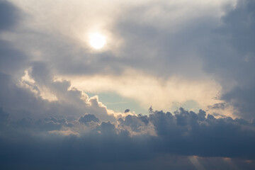 Beautiful background with sky and clouds. Cumulus clouds and bright sun.