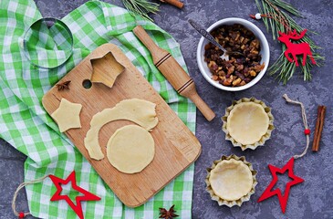 Step-by-step cooking of mince pies  traditional British Christmas shortcrust pastry cakes stuffed with dried fruits, nuts and apples.