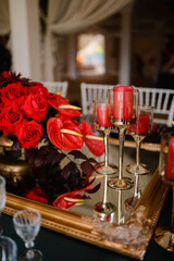 Romantically decorated table for a special event. Red decoration for celebration