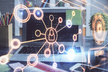 Computer on desktop with social network hologram. Double exposure. Concept of international people connections.