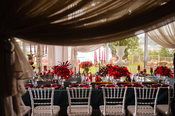 Romantically decorated table for a special event. Red decoration for celebration