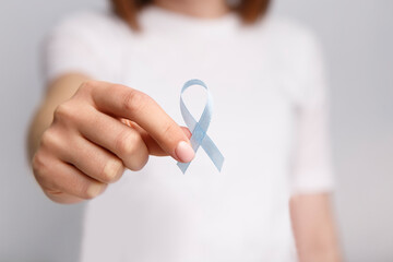 National Child Abuse Prevention Month. Light blue awarness ribbon