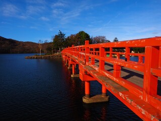 red wooden approach bridge 