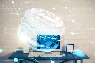 Double exposure of desktop computer and technology theme hologram. Concept of software development.