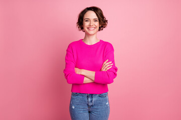 Photo of pretty attractive cheerful lady self-confident person arms crossed good mood wear casual sweater pullover jeans isolated pink pastel color background