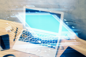 Double exposure of desktop computer and technology theme hologram. Concept of software development.