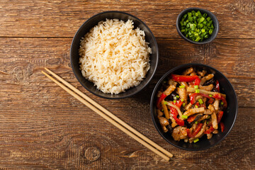 Pork chop with peppers, mushrooms and bamboo. Served with rice.