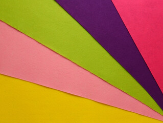 Fan of colored bright felt textile material.