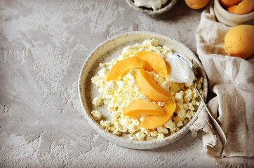 Fresh homemade cottage cheese with sour cream and apricots, breakfast, still life