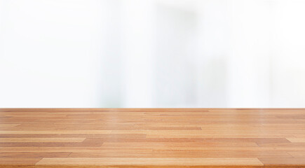 A beautiful empty wood board  with white blur glass window wall building background .For montage product display or design key visual layout background..