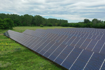 Renewable solar power plant. Aerial view as solar energy is converted by solar cells into electrical current. Alternative clean green energy renewable solar energy use. In Europe, Hungary.