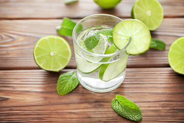 Mojito and lime on wooden backgroud