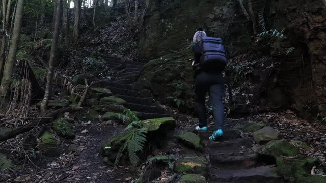 Young Active Unrecognisable Woman Walking Up The Stone Steps Deep In The Grand Canyon Of Blue Mountains, Australia.
