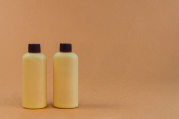brown plastic bottles of shampoo