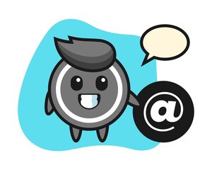 Hockey puck cartoon standing beside the At symbol
