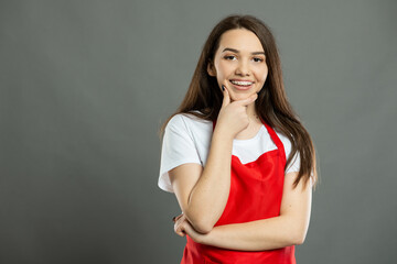 Portrait of young female supermarket employee camera looking and smiling