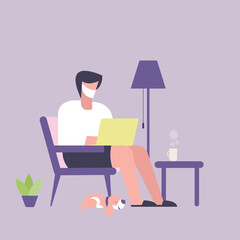 A man wearing mask working on laptop at his home. A work at home concept.