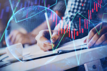Multi exposure of two men planing investment with stock market forex chart.