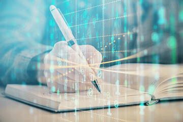 Multi exposure of woman's writing hand on background with data technology hud. Concept of...