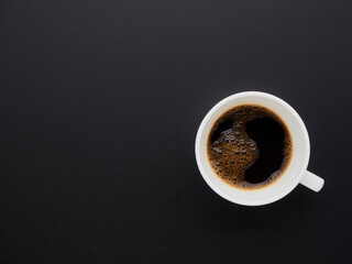 Black coffee on black background