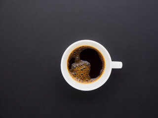 Obraz na płótnie Canvas Black coffee on black background