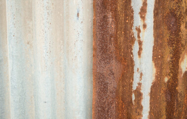Close up rust on half galvanized sheet.