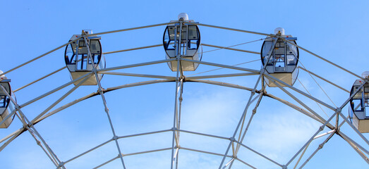 Ferris wheel against the blue sky