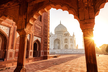 The magnificent Taj Mahal in India shows its full splendor at a glorious sunrise. - obrazy, fototapety, plakaty